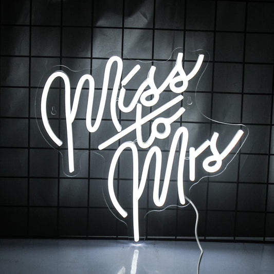 The image features a stylish LED neon sign displaying the words "Miss To Mrs" in a flowing script font.