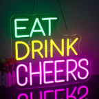 The image displays a vibrant and colorful LED neon sign with three lines of text.