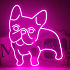 Das Bild zeigt ein leuchtend rosa LED-Neonschild in Form der Umrisse eines Hundes.