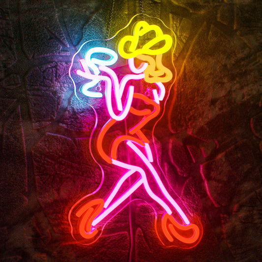 A vibrant LED neon sign depicting the silhouette of a sultry woman in a dynamic pose.