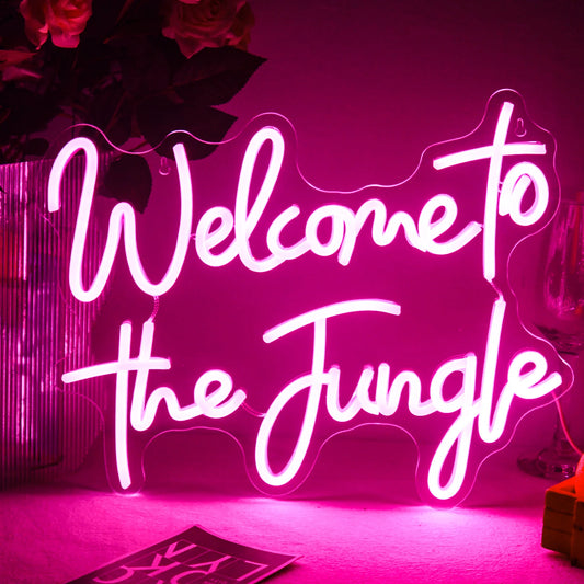 A vibrant "Welcome to the Jungle" LED neon sign is displayed against a dark background.