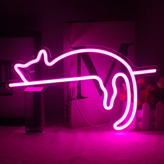 Image description: A vibrant LED neon sign shaped like a cat is mounted on a wall.