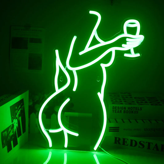 The image features a vibrant LED neon sign depicting the outline of a stylishly dressed woman holding a wine glass.