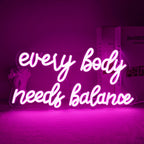 Das Bild zeigt ein leuchtendes LED-Neonschild mit der Aufschrift „Every Body Needs Balance“.