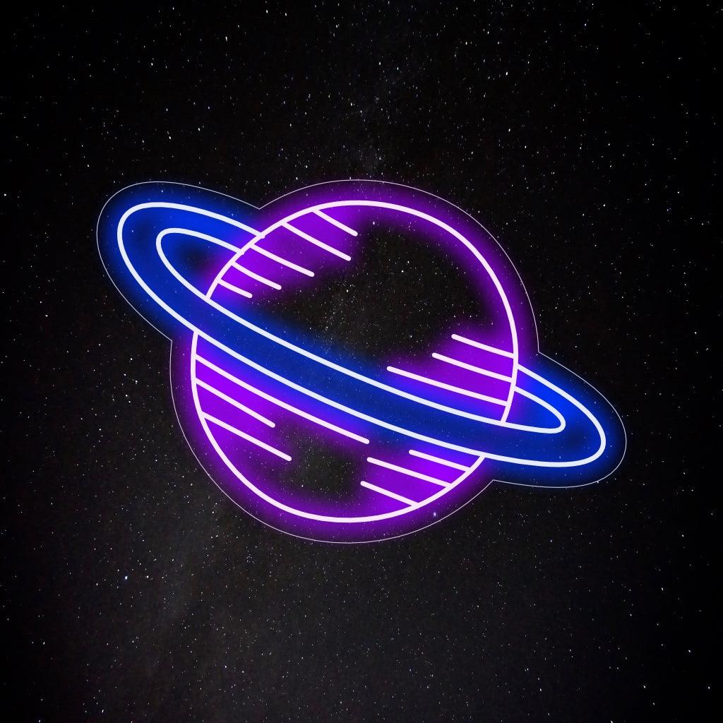 An illuminated neon sign featuring the planet Saturn, representing the beauty and mystery of space, and adding a cosmic touch to any space