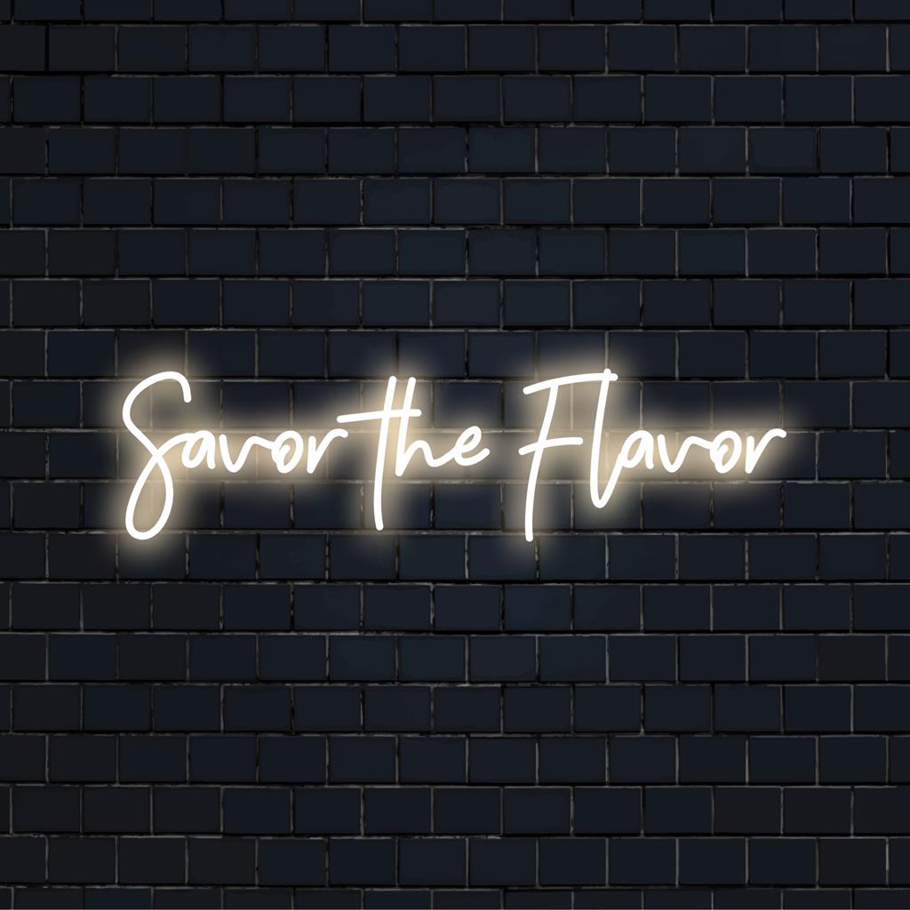 Glowing Savor The Flavor LED neon sign, perfect for modern decor, captures trendy aesthetic and ambient lighting style.