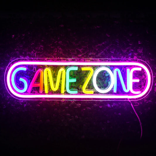 The image displays a vibrant, colorful LED neon sign that reads "Game Zone" in bold, eye-catching letters.