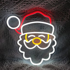 Das Bild zeigt ein helles und festliches LED-Neonschild mit der Aufschrift „Frohe Weihnachten“.