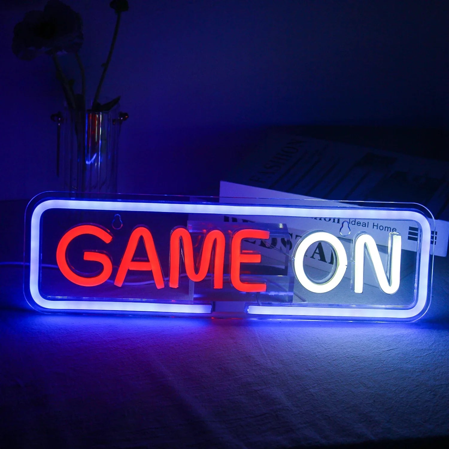 The image displays a vibrant LED neon sign featuring the words "Gamer On" in bold, eye-catching letters.