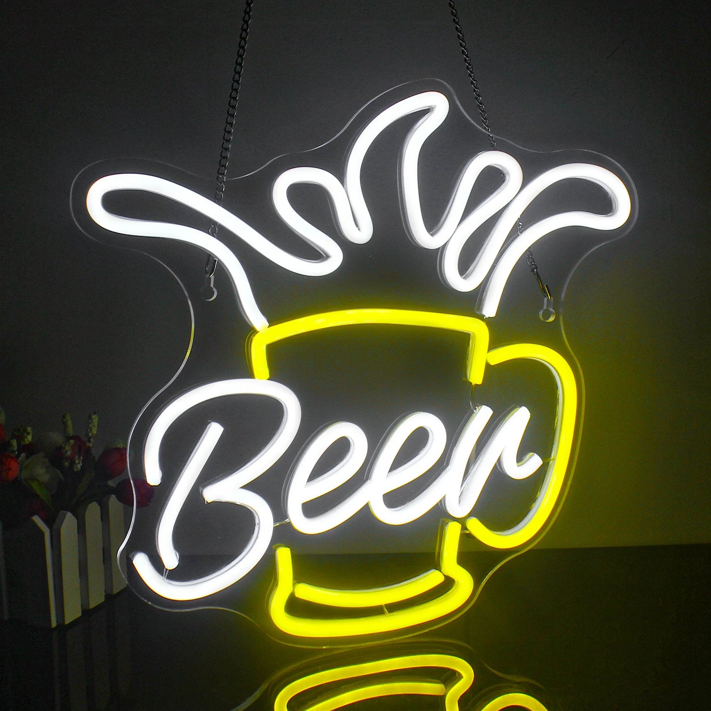 The image features a vibrant LED neon sign shaped like a frothy beer mug.