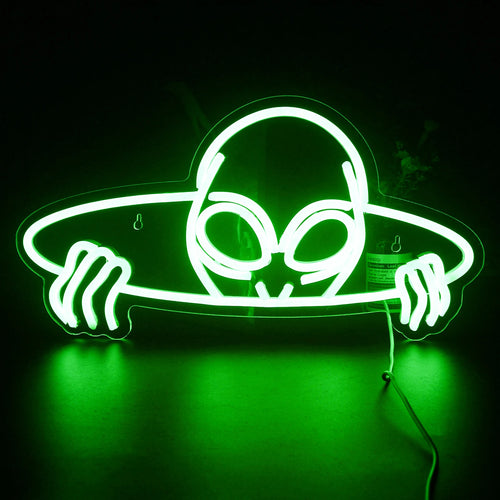 Ein leuchtendes LED-Neonschild in Form eines Alienkopfes mit großen, mandelförmigen Augen.