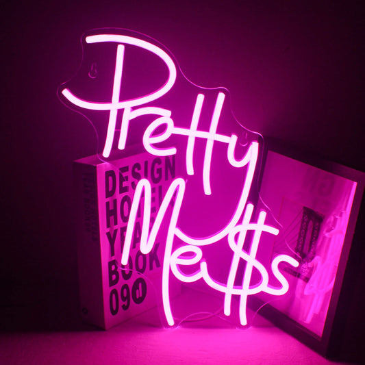 The image features a vibrant, handmade LED neon sign displaying the words "Pretty Mess" in an elegant, cursive font.