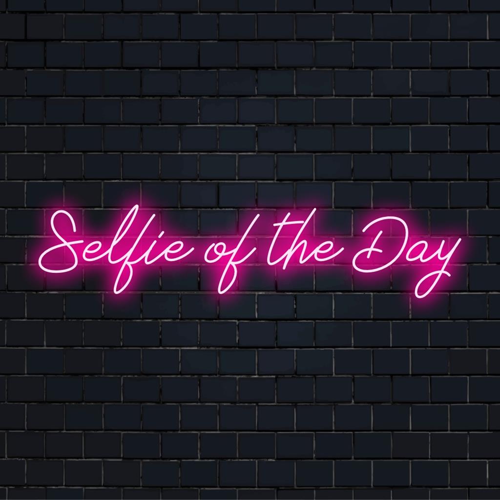Vibrant custom LED neon sign displaying 'Selfie Of The Day', ideal for adding a modern, personalized touch to any space.