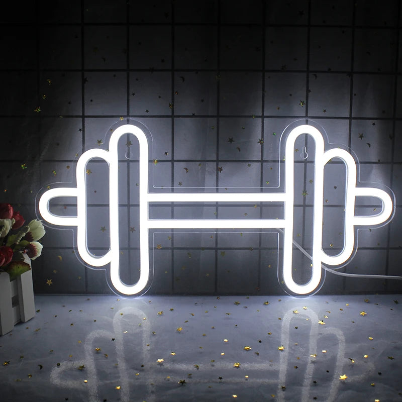 Ein leuchtendes LED-Neonschild in Form einer Hantel, das in einer auffälligen Kombination heller Farben leuchtet.