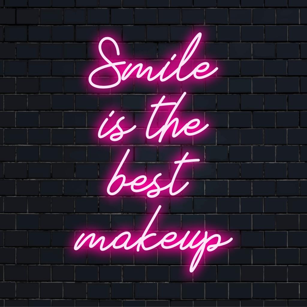 Custom LED neon sign displaying Smile Is The Best Makeup, perfect for adding vibrant personality to any space.