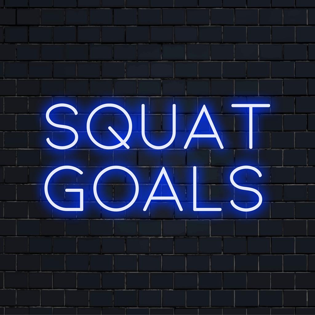 Custom LED neon sign reading Squat Goals illuminated in vibrant light, perfect for gym decor or motivational wall art.