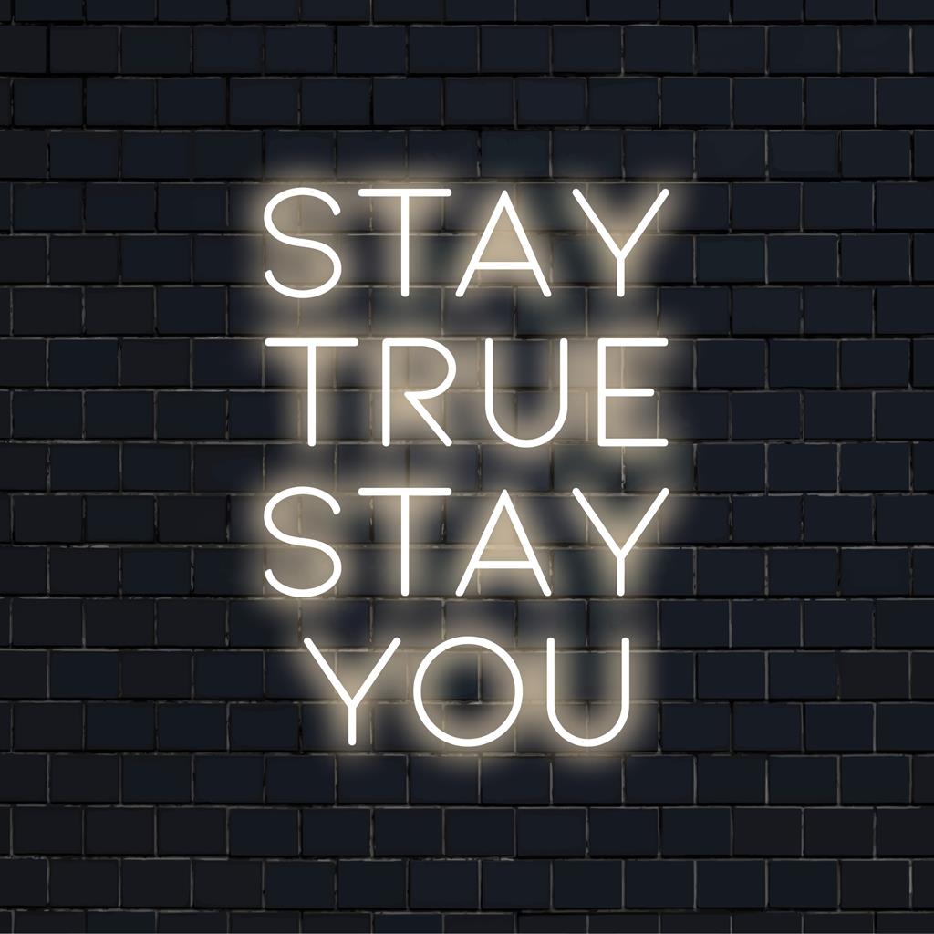 Custom-made LED neon sign featuring Stay True Stay You; perfect for personal mantra decor with unique glowing ambience.