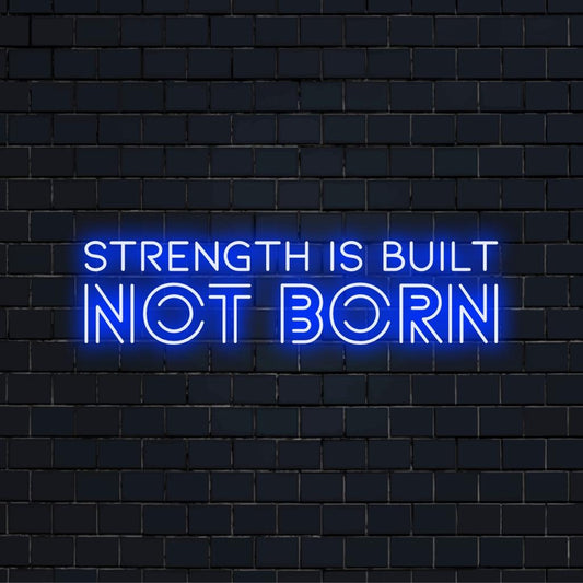 Vibrant custom LED neon sign depicting Strength Is Built Not Born, perfect motivation wall art for personal spaces.