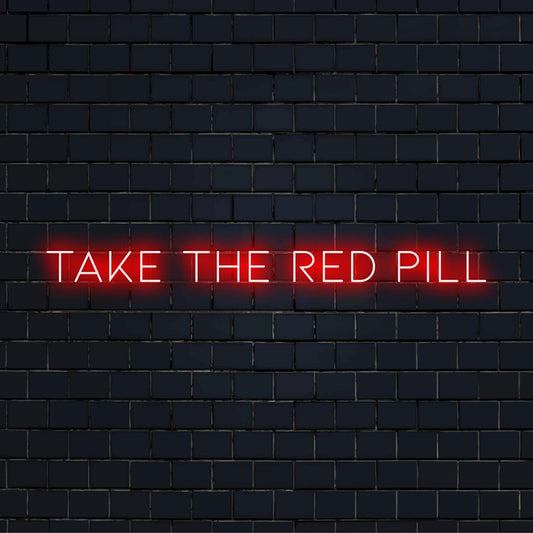 LED neon sign displaying the phrase Take The Red Pill in vibrant, eye-catching light. Perfect for modern wall decor.