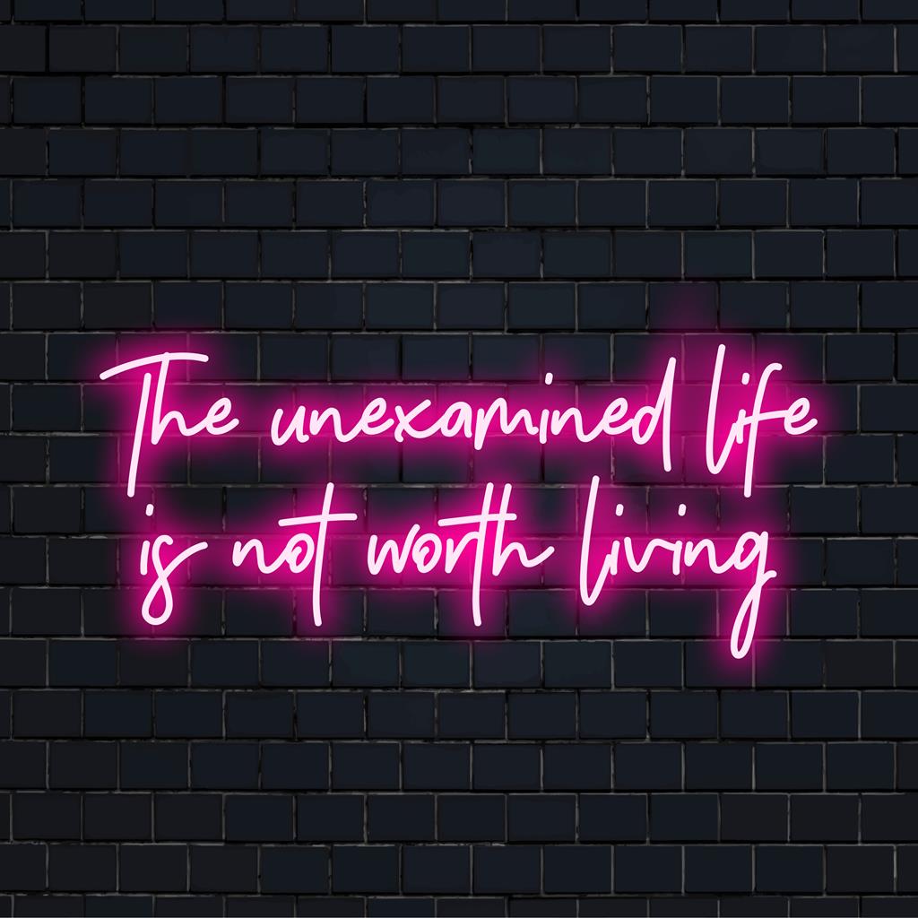 LED neon sign displaying The Unexamined Life Is Not Worth Living in vibrant hues, perfect for thought-provoking decor.