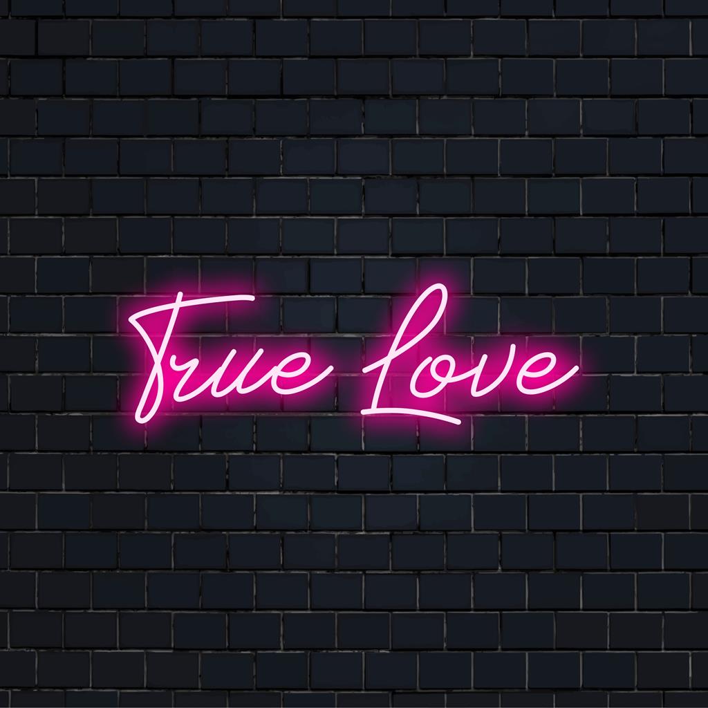 Bright LED neon sign reading True Love, adding a touch of romance and personal style, ideal for home or events.