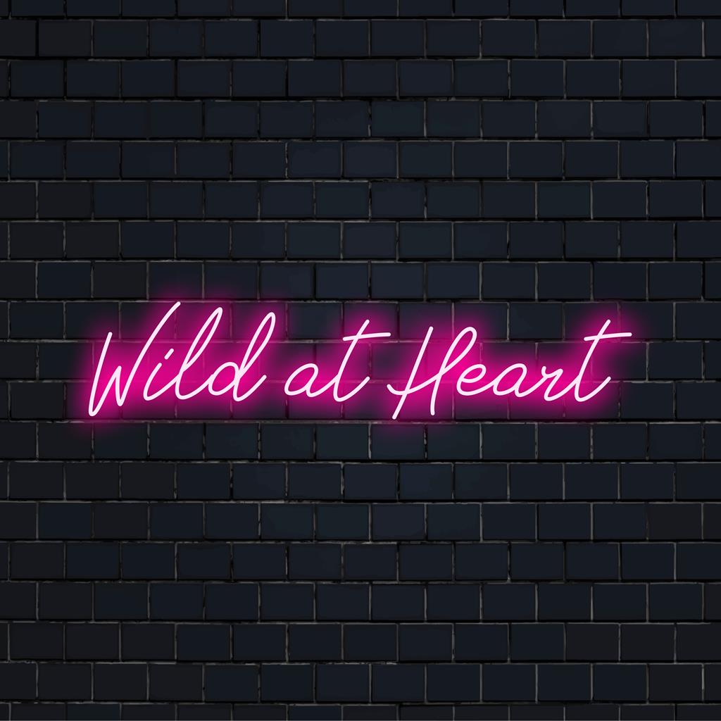 Wild At Heart vibrant neon sign lighting up the room, custom LED design adding chic decor to any space.