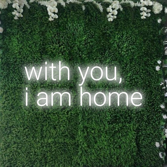 LED neon sign with With You, I Am Home; perfect personalized decor, blending sentiment with glowing ambiance.