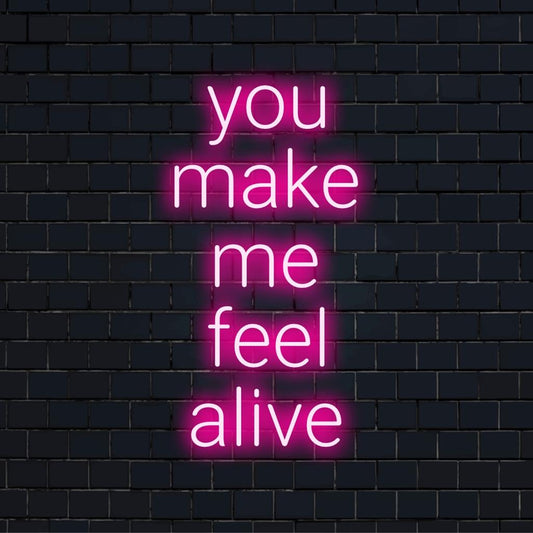Custom LED neon sign spelling You Make Me Feel Alive in bold script, glowing in vibrant colors against a dark background.