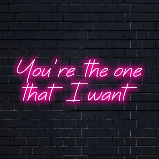 Custom made LED neon sign showcasing You're The One That I Want in elegant script, ideal for personalized neon decor.
