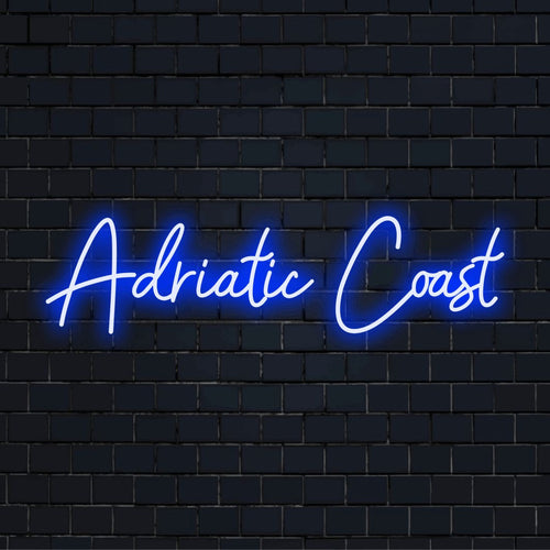 Adriatic Coast Neon Sign, neon text light against black brick wall