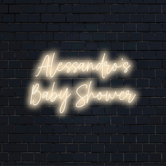 Alessandro_s Baby Shower Personalized LED Neon Sign, glowing neon text on black brick background