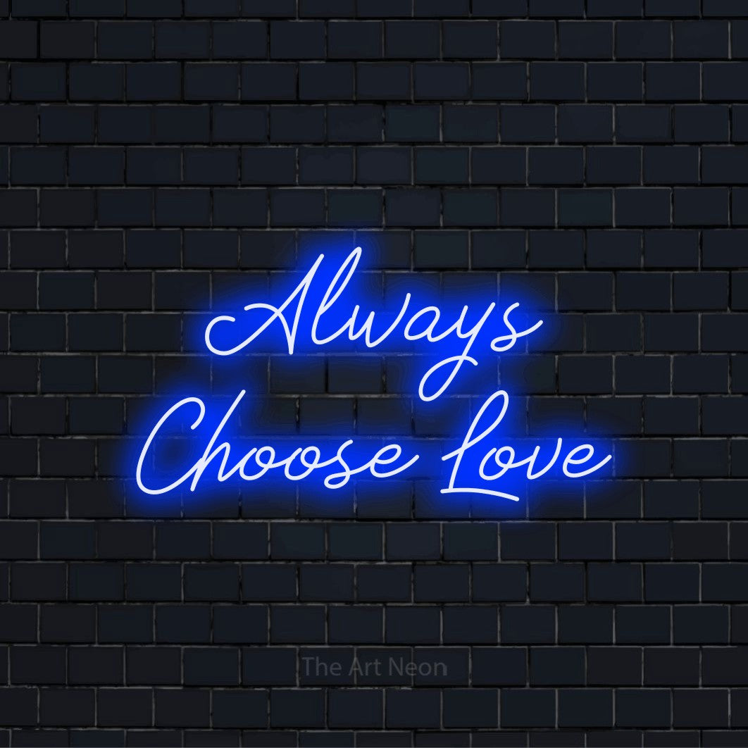 "Always Choose Love" glowing LED neon sign on a black brick wall