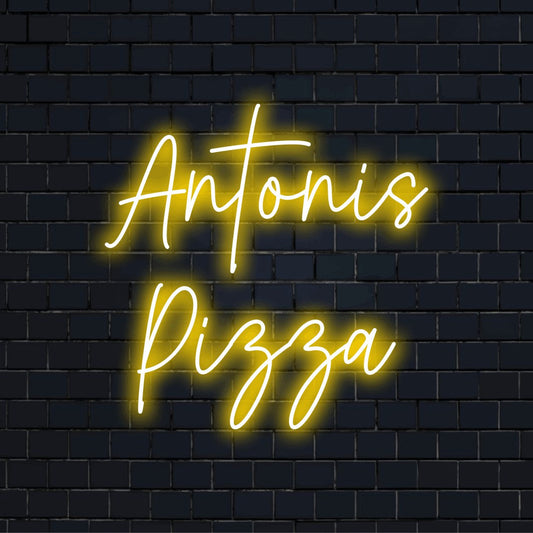 Antonis Pizza Personalized LED Neon Sign, glowing lettering on black brick background