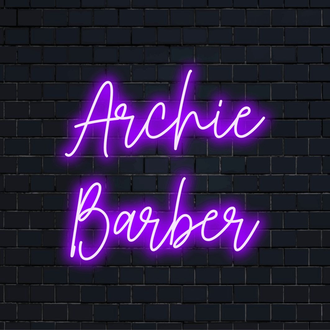 Archie Barber Custom Name Neon Sign, neon text light against brick backdrop