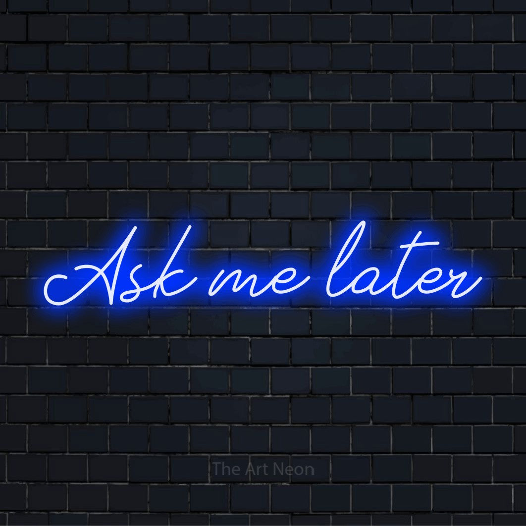 "Ask Me Later" neon text design on a black brick wall