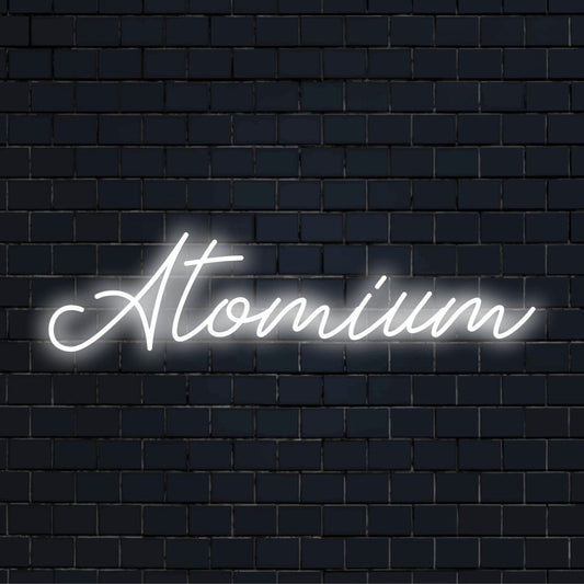 Atomium Neon Sign, glowing neon text on dark brick wall