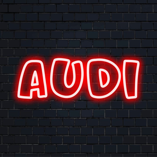 Audi LED Neon Sign, glowing lettering against brick backdrop