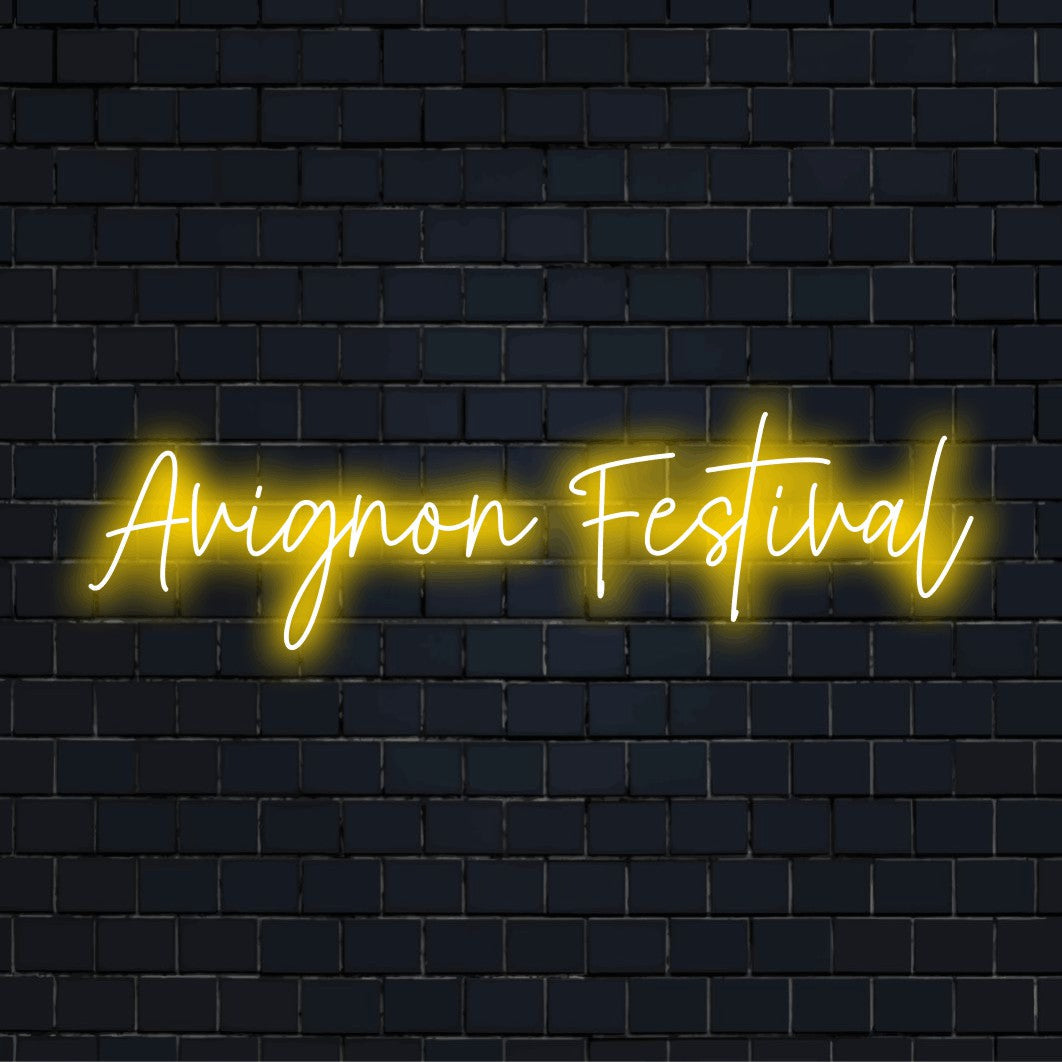 Avignon Festival LED Neon Sign, bright neon glow against black brick wall