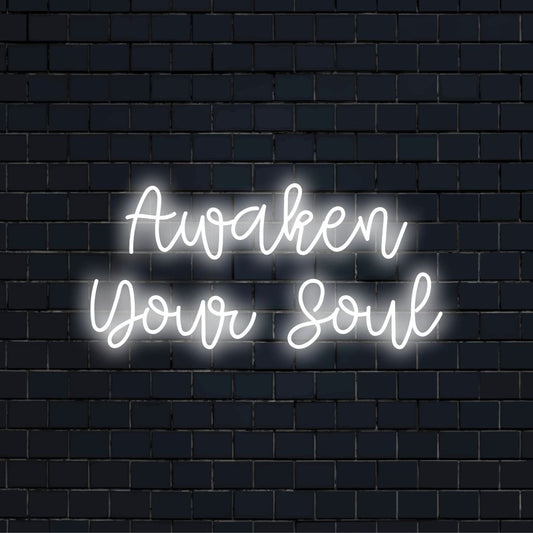 Awaken Your Soul Neon Light with bright neon glow against black brick wall