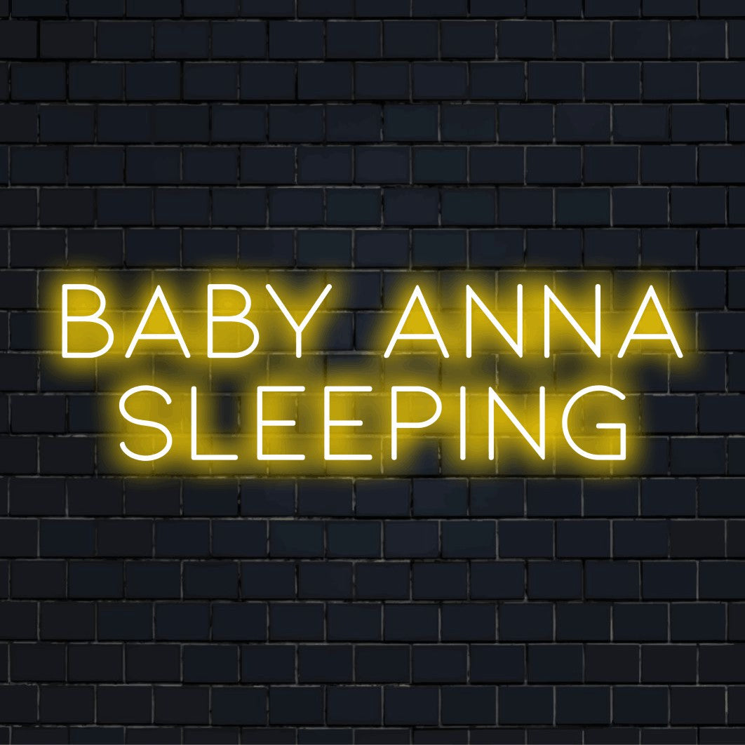 Baby Anna Sleeping Personalized LED Neon Sign, glowing neon text on dark brick wall