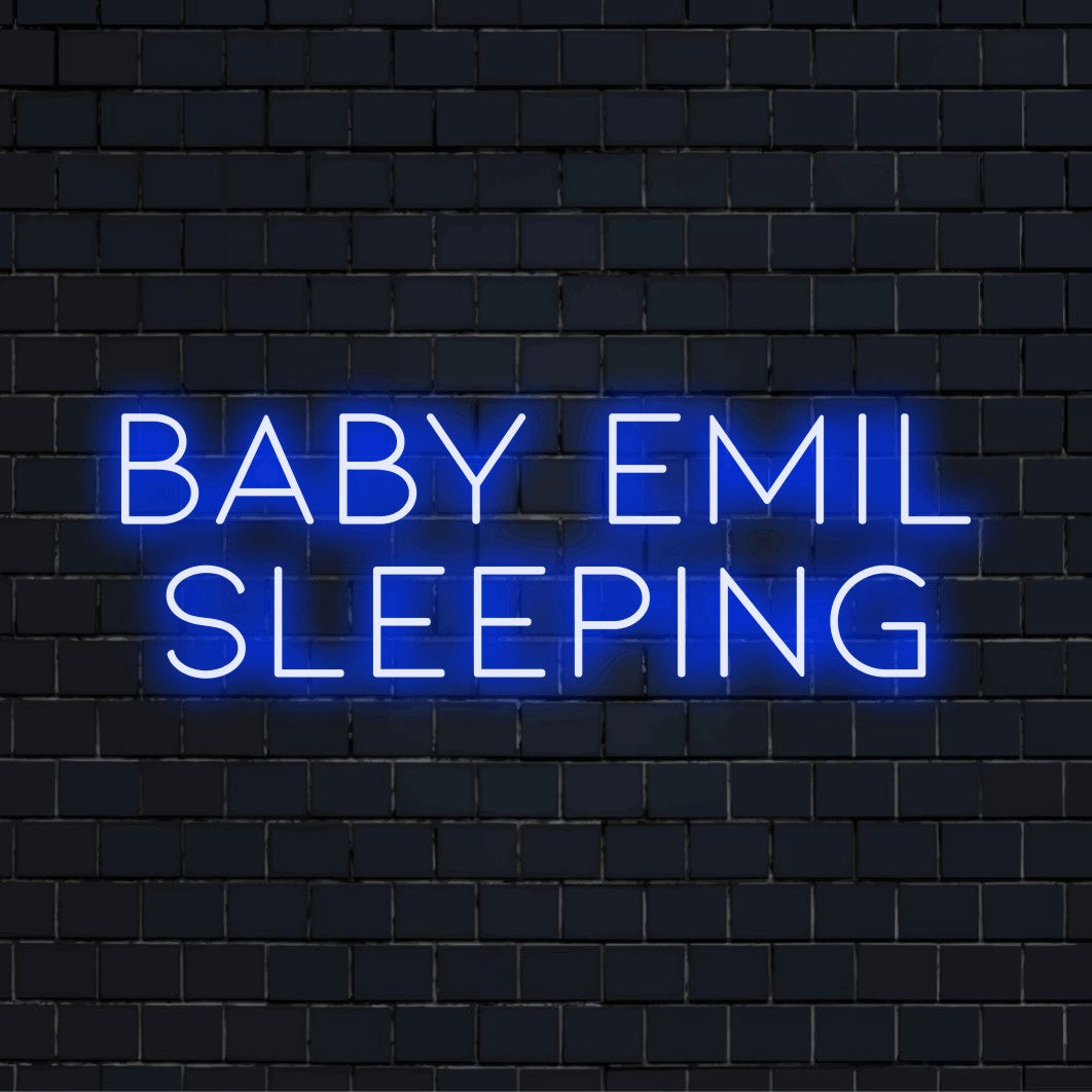 Baby Emil Sleeping Custom Name Neon Sign, bright LED glow on dark brick background