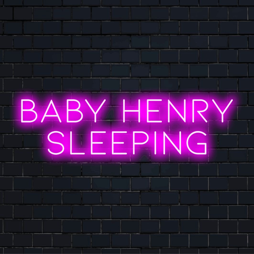 Baby Henry Sleeping Personalized Neon Light with bright neon glow on dark brick wall