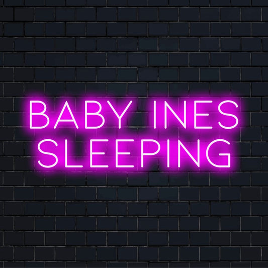Baby Ines Sleeping Custom Name Neon Sign, neon text light on dark brick wall