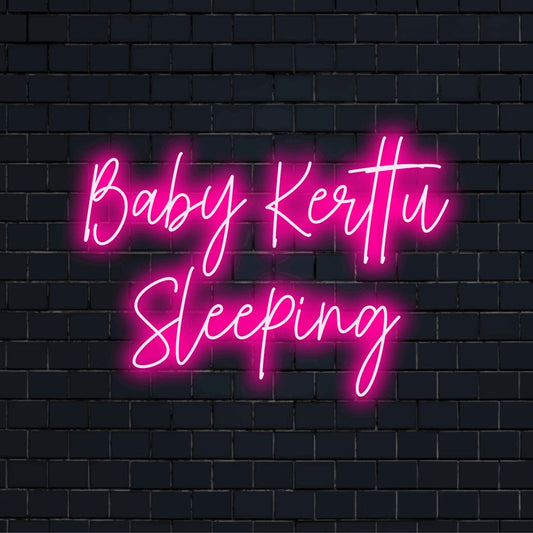 Baby Kerttu Sleeping Custom Name Neon Sign, glowing wall decor on dark brick wall