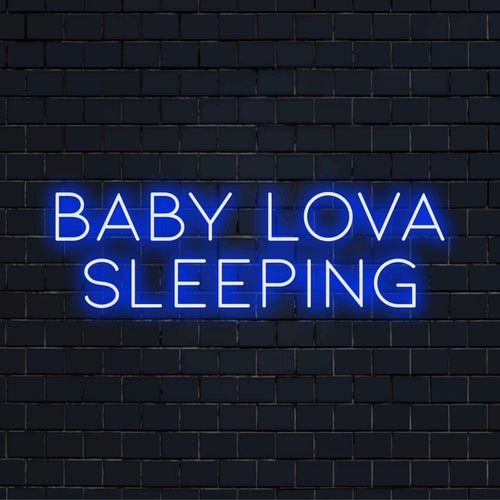 Baby Lova Sleeping Personalized LED Neon Sign, soft neon glow on dark brick wall