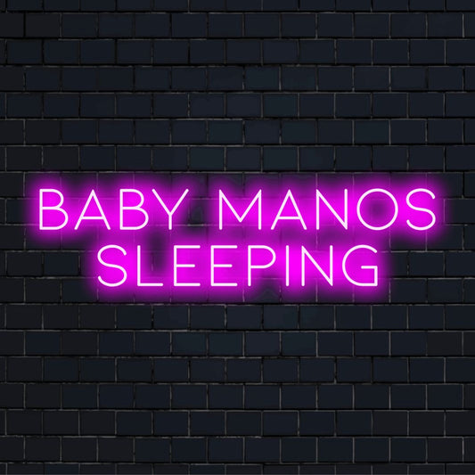 Baby Manos Sleeping Personalized Neon Light with neon text light on dark brick background