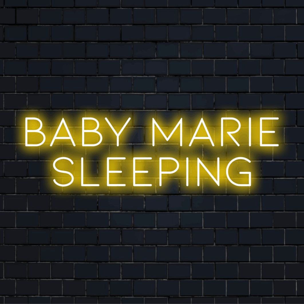 Baby Marie Sleeping Personalized Neon Light with bright neon lettering on dark brick wall