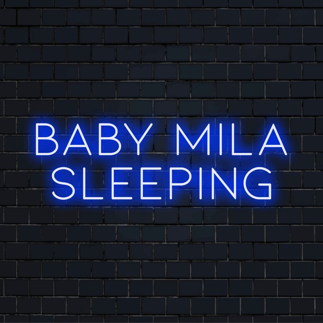 Baby Mila Sleeping Personalized LED Neon Sign, neon text light on dark brick wall