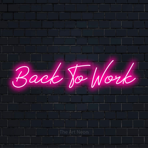 "Back To Work" LED neon sign on a black brick wall