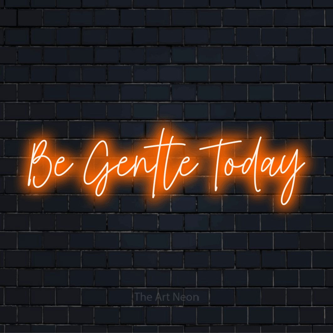 "Be Gentle Today" text design with neon effect on a black brick wall